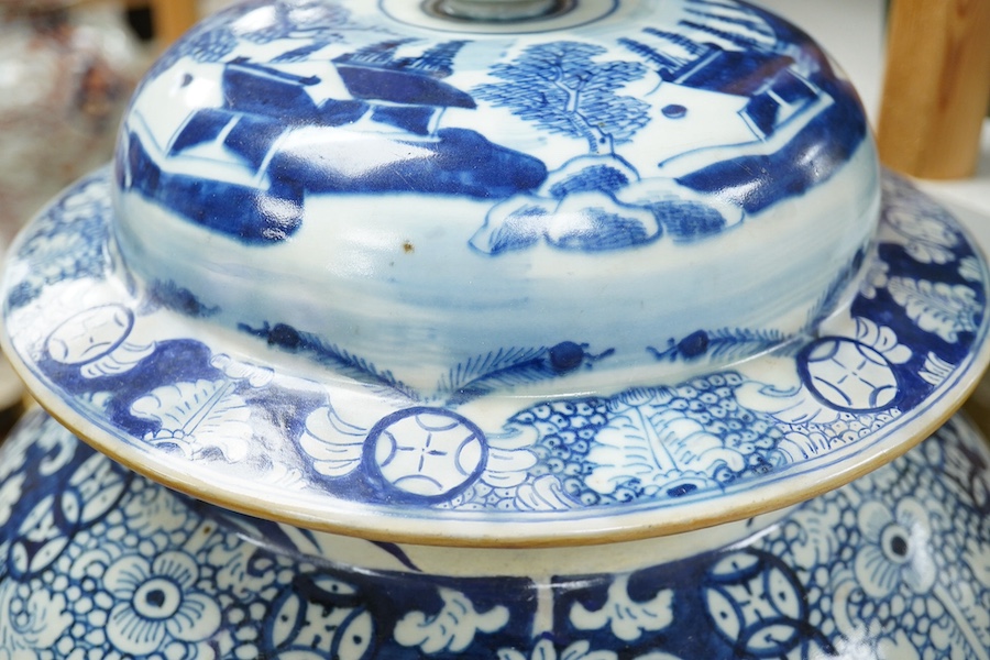 A large 19th century Chinese blue and white vase with cover, 63cm high. Condition - restored